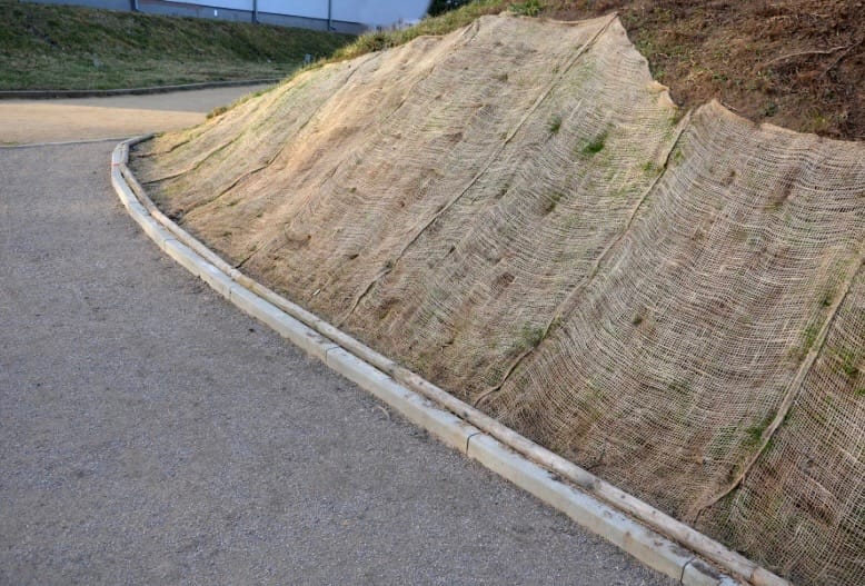 erosion control blanket installed on the slope of a hill 