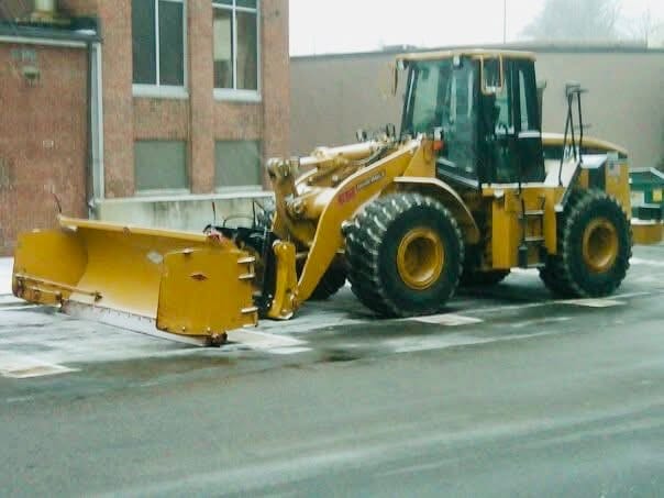 front end loader parked at newton mass retail plaza, getting ready for snow removal as storm approaches