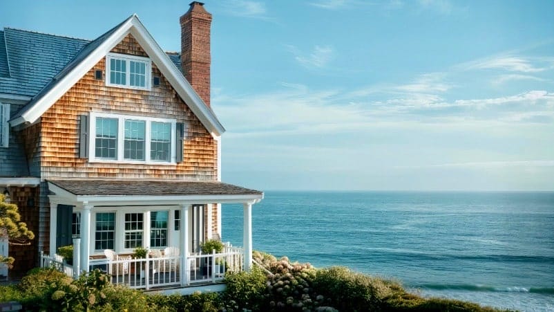 Coastal home view of the ocean and side of the house