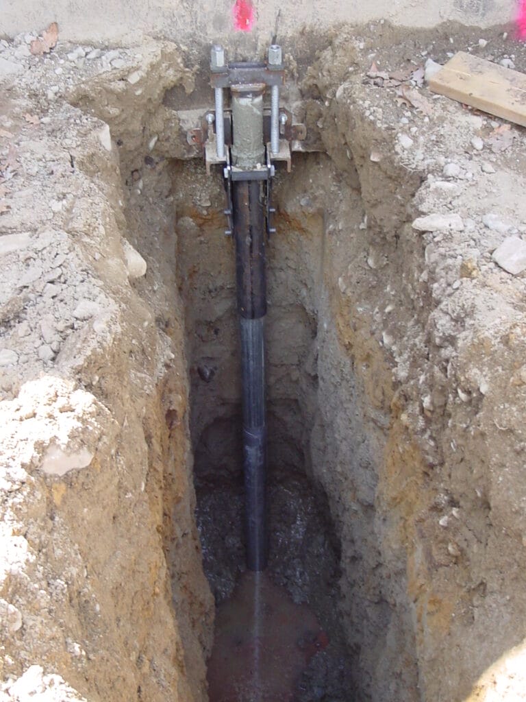 underpin for foundation showing pin installation and trench - Westwood MA