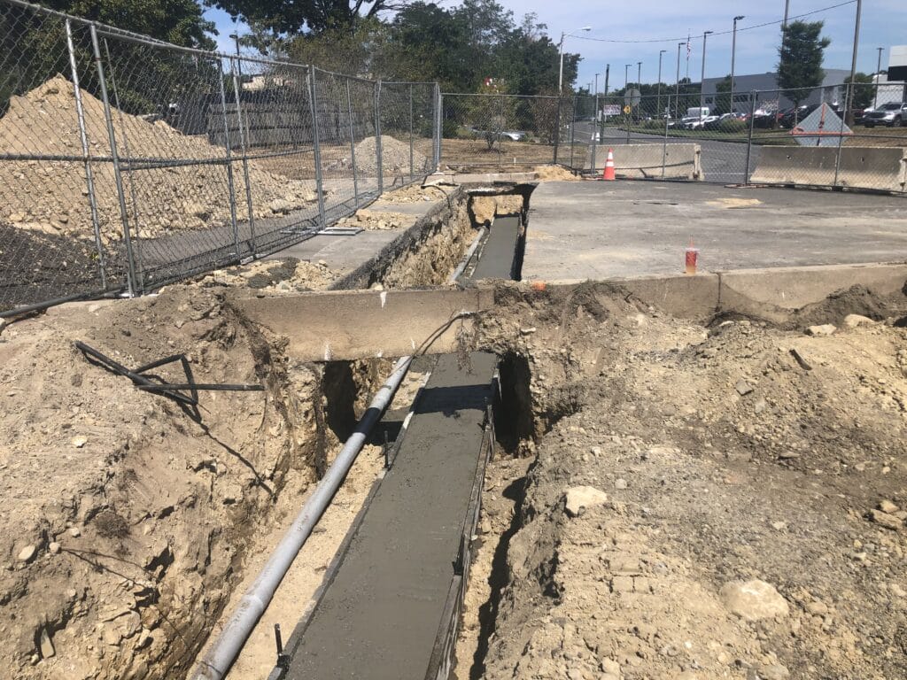 utility trench and footing support for parking lot lighting bases in eastern MA - site work