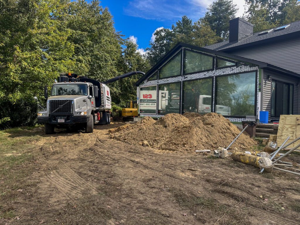 Residential Construction with vacuum truck and foundation replacement and addition in southern NH