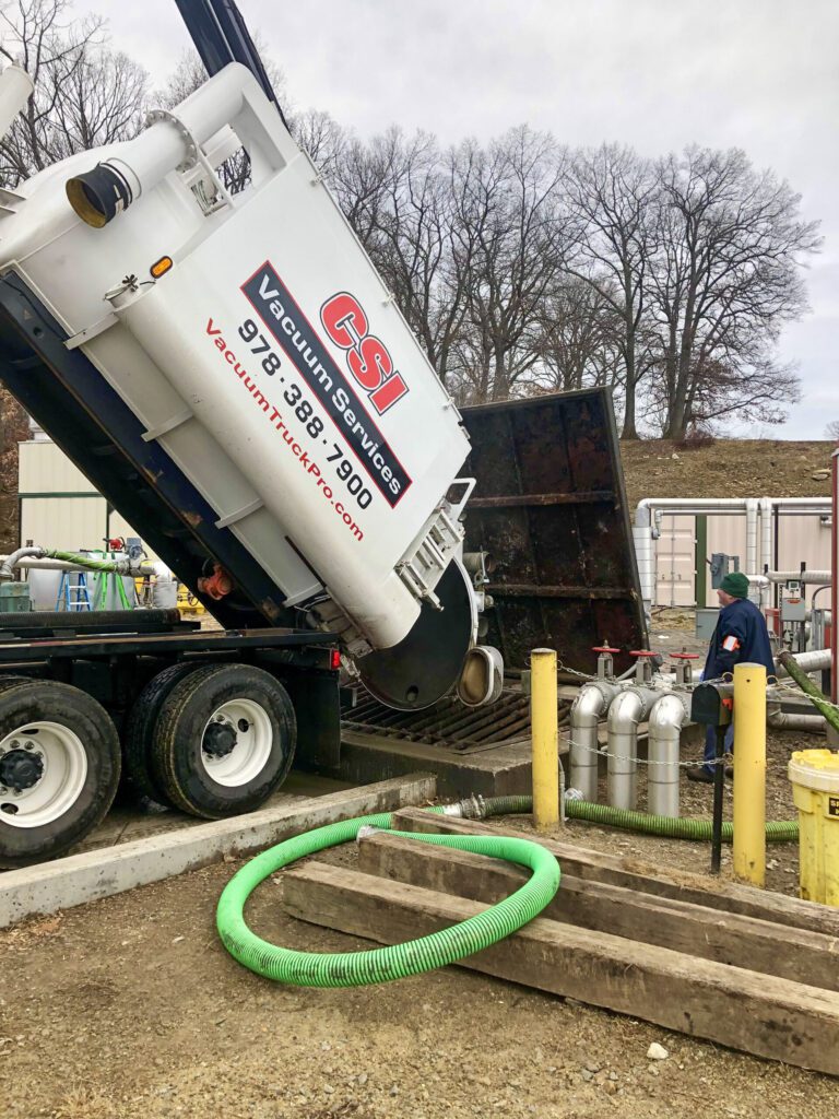vac truck properly disposing of load after service