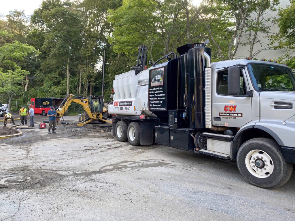 vac truck assisting in water main break for safe excavation 