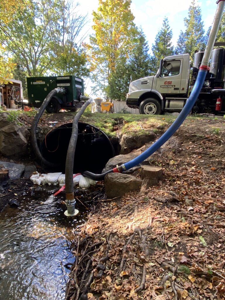 drainage culvert being cleaned