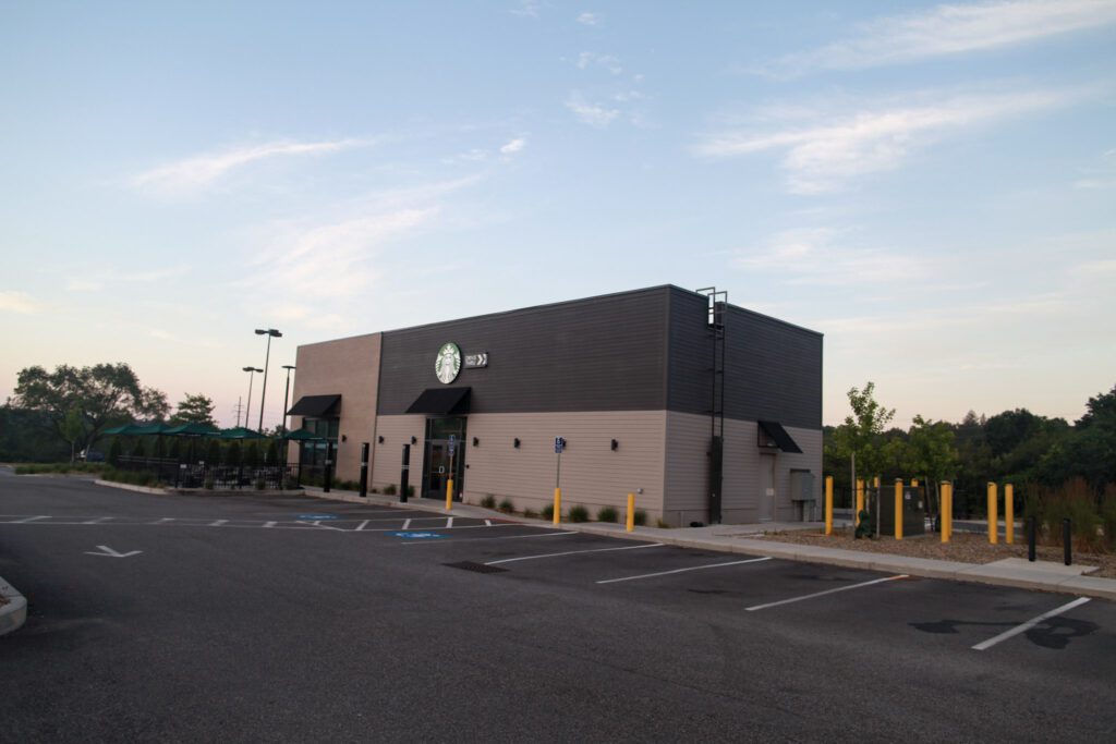 Pedestrian walkway and barrier curbs in front of new design build Starbucks in Danvers MA