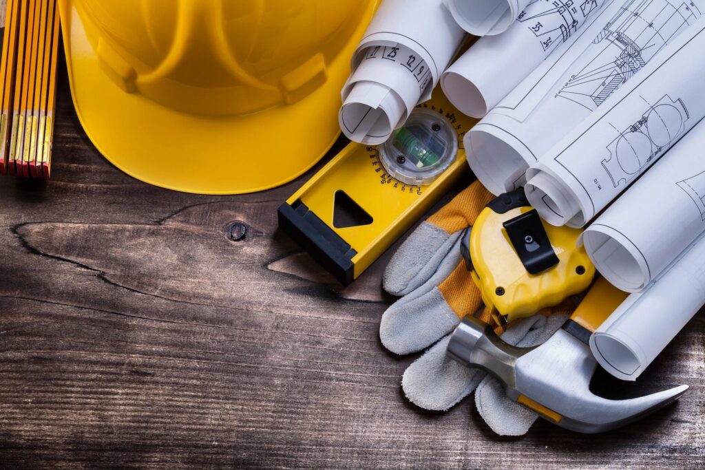 building plans and hard hat